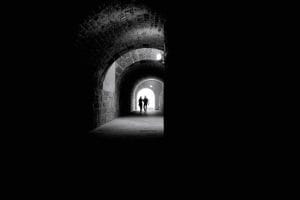 Tunnel with couple at the end